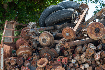 Rusted Old Axles, Spare Parts of vehicle, selective focus. Background. Horizontal. Front view