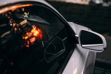 The sun's reflection in the glass of the car