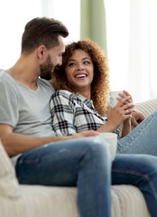 loving couple sitting on a sofa in the living room
