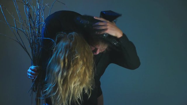 The zombie carries his victim on his shoulder. 4k, slow motion, Halloween concept