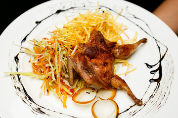 Quail with potatoes and vegetables