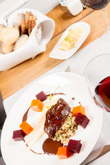 Beef cheeks with vegetables, roasted parsley root mousse , pearl barley, dark chocolate and demi glace sauce