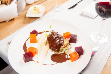 Beef cheeks with vegetables, roasted parsley root mousse , pearl barley, dark chocolate and demi glace sauce