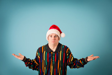 Shrugging Christmas Guy in Ugly Sweater and Santa Hat