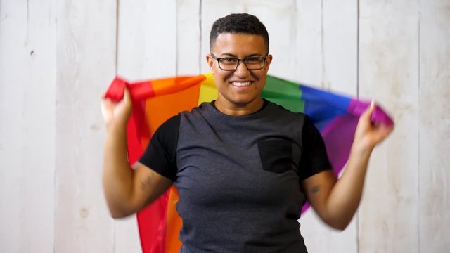 Queer gay black person with pride flag