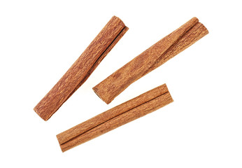 Aromatic cinnamon sticks on white background