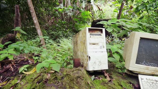 Reveal Pan of an abandoned PC in the middle of a Costa Rica jungle