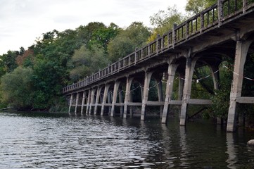Old stone bridge in the water - luna park