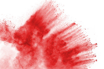 Freeze motion of red powder exploding, isolated on white background. Abstract design of red dust cloud. Particles explosion screen saver, wallpaper