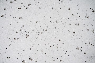 white concrete wall with bubbles