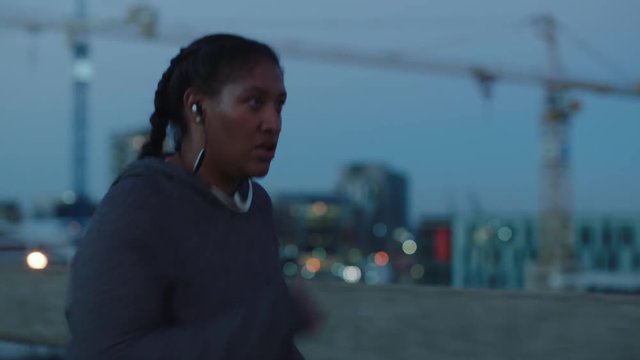 tough overweight woman running weight loss exercising african american female jogging cardio challenge in city at sunset