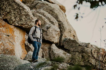 Obraz na płótnie Canvas Man hiking in rocky mountains