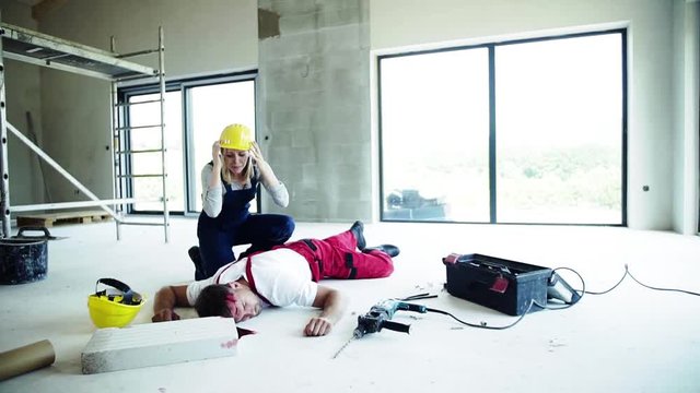 A woman found man worker lying unconscious on the floor at the construction site.