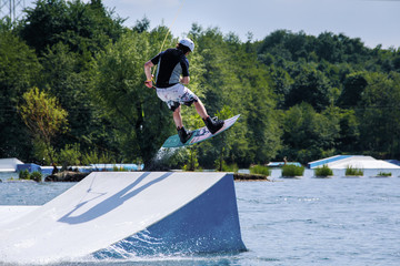 wakeboarding man and Wakeboard driver on hill