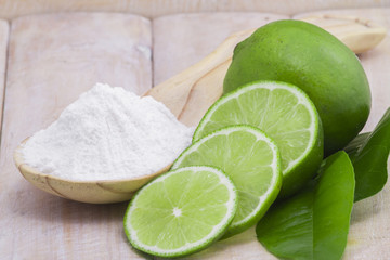 baking soda and lemon on the wooden table