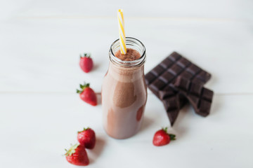 smoothie chocolate with strawberry or milkshakes, natural and organic drink in the glass jar