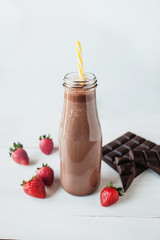 smoothie chocolate with strawberry or milkshakes, natural and organic drink in the glass jar