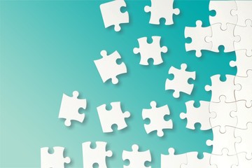 White puzzle pieces on light background