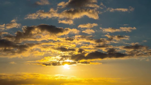 Sun and clouds at sunset, timelapse