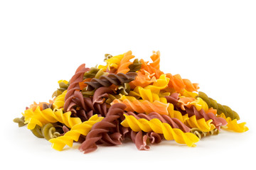 Bunch of colored pasta on a white, isolated.