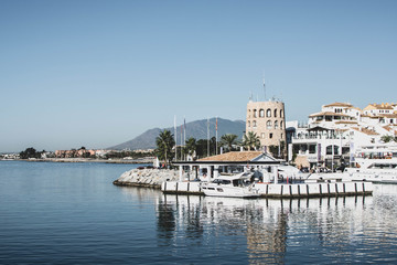 Fototapeta premium Puerto Banus marina of Marbella, on Costa del Sol, Spain, the view of moorish tower.