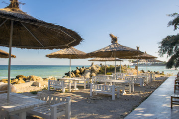 Empty cafe bar on the public beach in the early morning