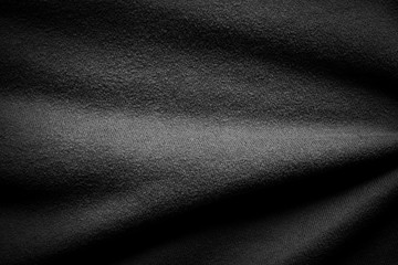 Fototapeta premium Black background abstract cloth texture luxury silk dark fabric.