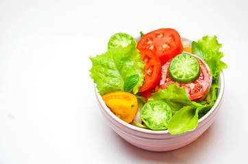 tomato and lettuce salad plate on white background 