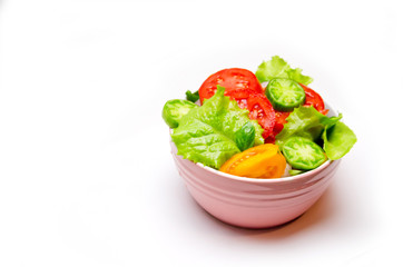 tomato and lettuce salad plate on white background