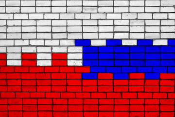 Colors of national flags of Poland and Russia on rough stone wall texture