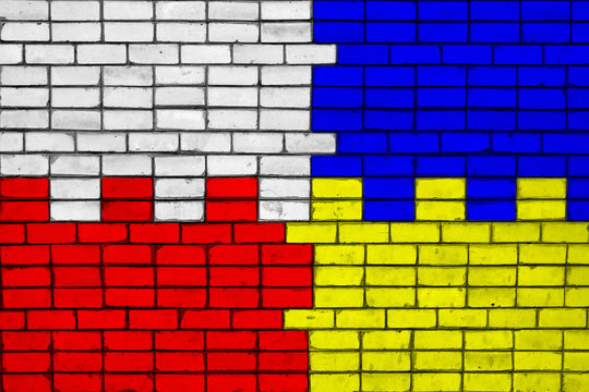 Colors of national flags of Poland and Ukraine on a brick wall texture