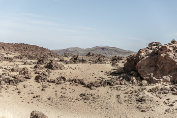Special view of the desert landscape in the famous Teide national park on the island of Tenerife with many rocks, Spain, on a sunny day