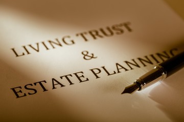 Fountain Pen Lying on the "Living Trust and Estate Planning" -