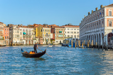 Fototapeta na wymiar Venice, Italy: Gondolier on Grand Canal near Rialto Fish Market