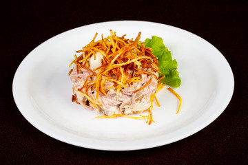 Russian salad with fried potato