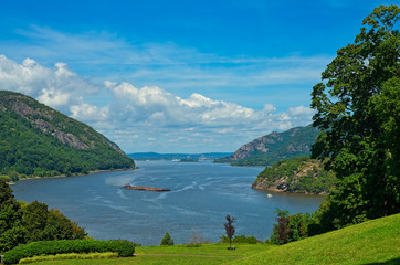 A barge making its way down the Hudson River as seen from West Point, New York - obrazy, fototapety, plakaty