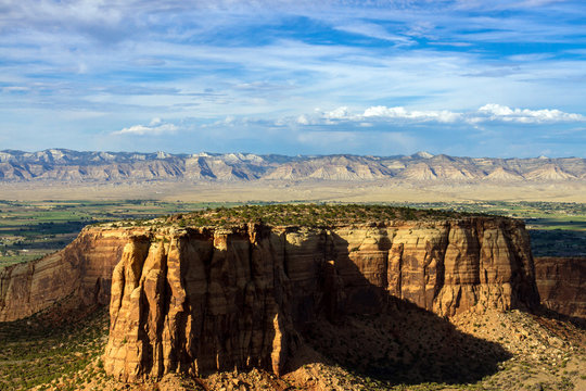 Colorado National Monument's backlit "Independence Monument" glows late in the evening, near the towns of Fruita and Grand Junction