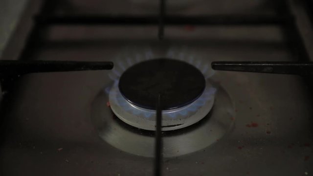 Ignition of the gas stove in the afternoon before cooking in slow motion