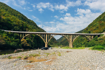 Fototapeta na wymiar Stone bridge over gorge of river Gumista, Abkhazia