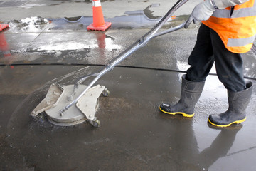 Industrial worker using a surface cleaner