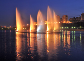 Cheboksary. Glowing fountains on the river Volga at night