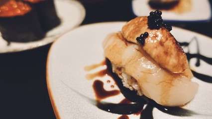 Sushi rolls, sashimi set, on dark wooden table, Japanese food, top view.   