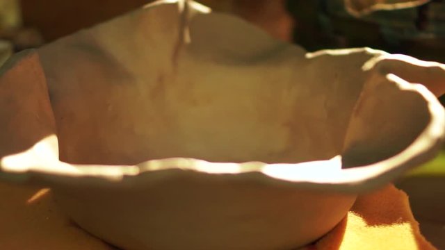 Presentaion of a handbuilt clay vessel