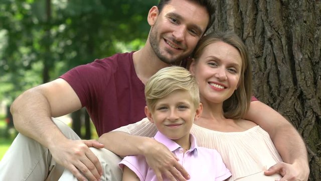 Family after visiting clinic, woman expecting second child, pregnancy screening