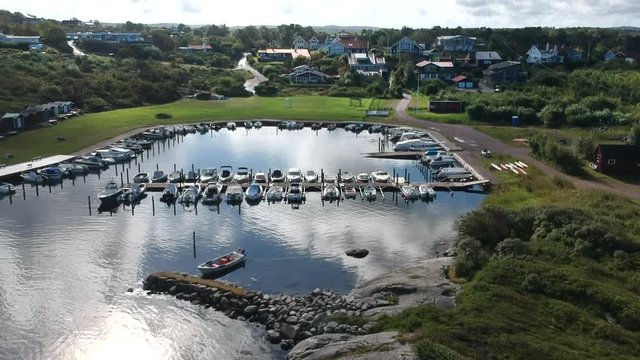 Aerial drone shot of a small marina at the ocean coastline on the west coast of Sweden in Halland outside of Gothenburg.