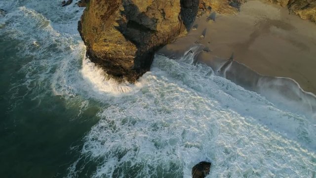 Dramatic coastal erosion of the cliffs along the coastline, drone aerial shot
