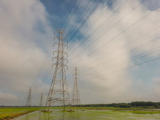 High voltage power on sky and cloud background.Transmission line tower.