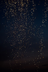 Celebratory fireworks on black background portrait orientation room for text