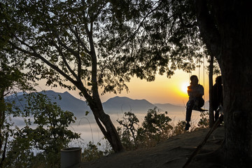 Sunrise with black shadow tourists