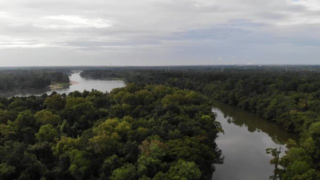 Drone aerial pan of the San Jacinto River and forest near Houston, Texas